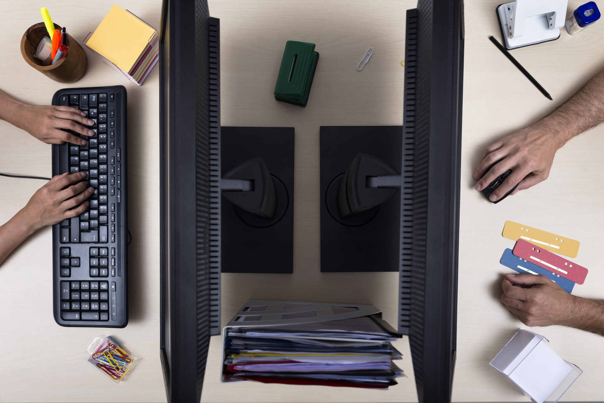 Two people working on desk