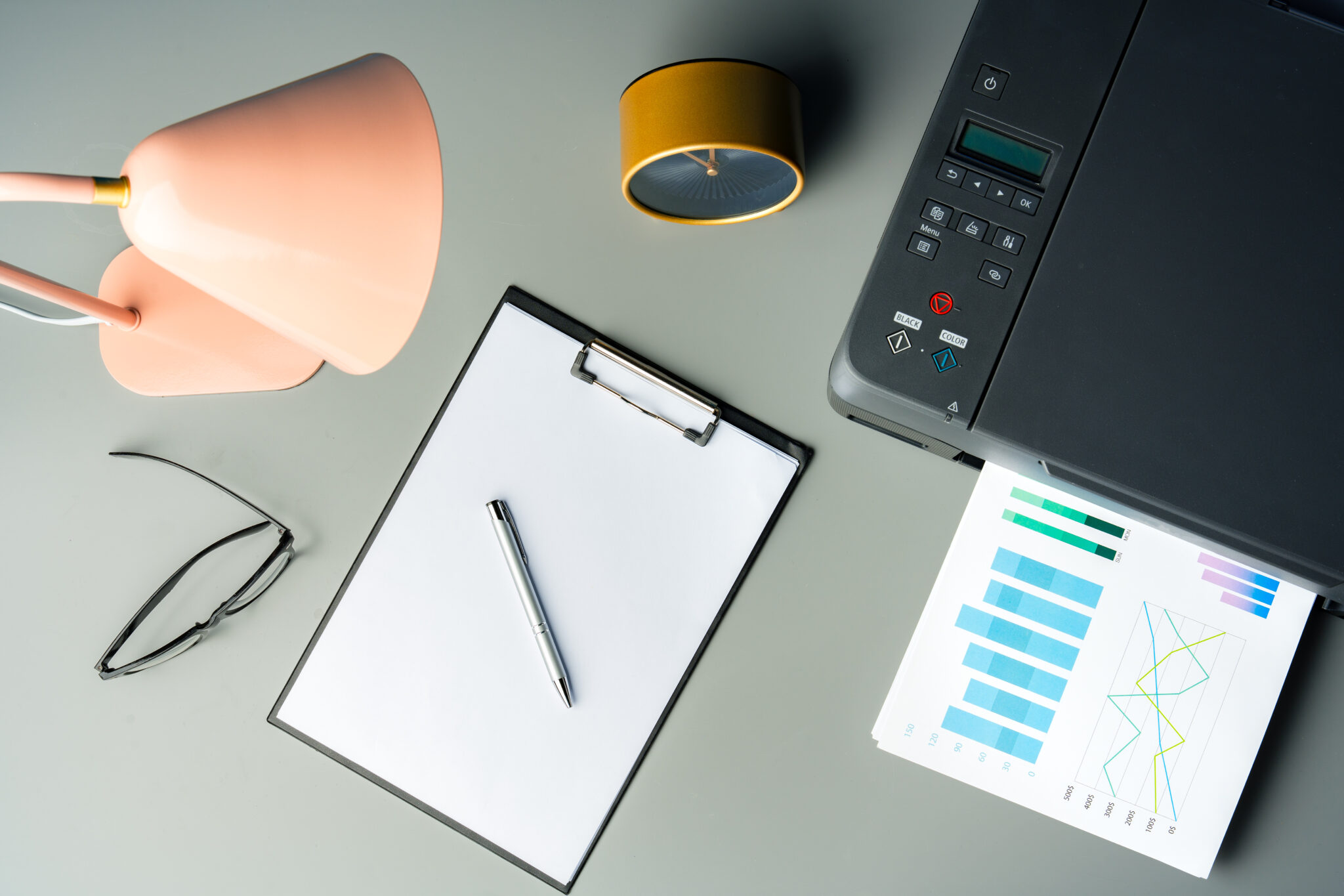 Printer with paper on gray background close up photo